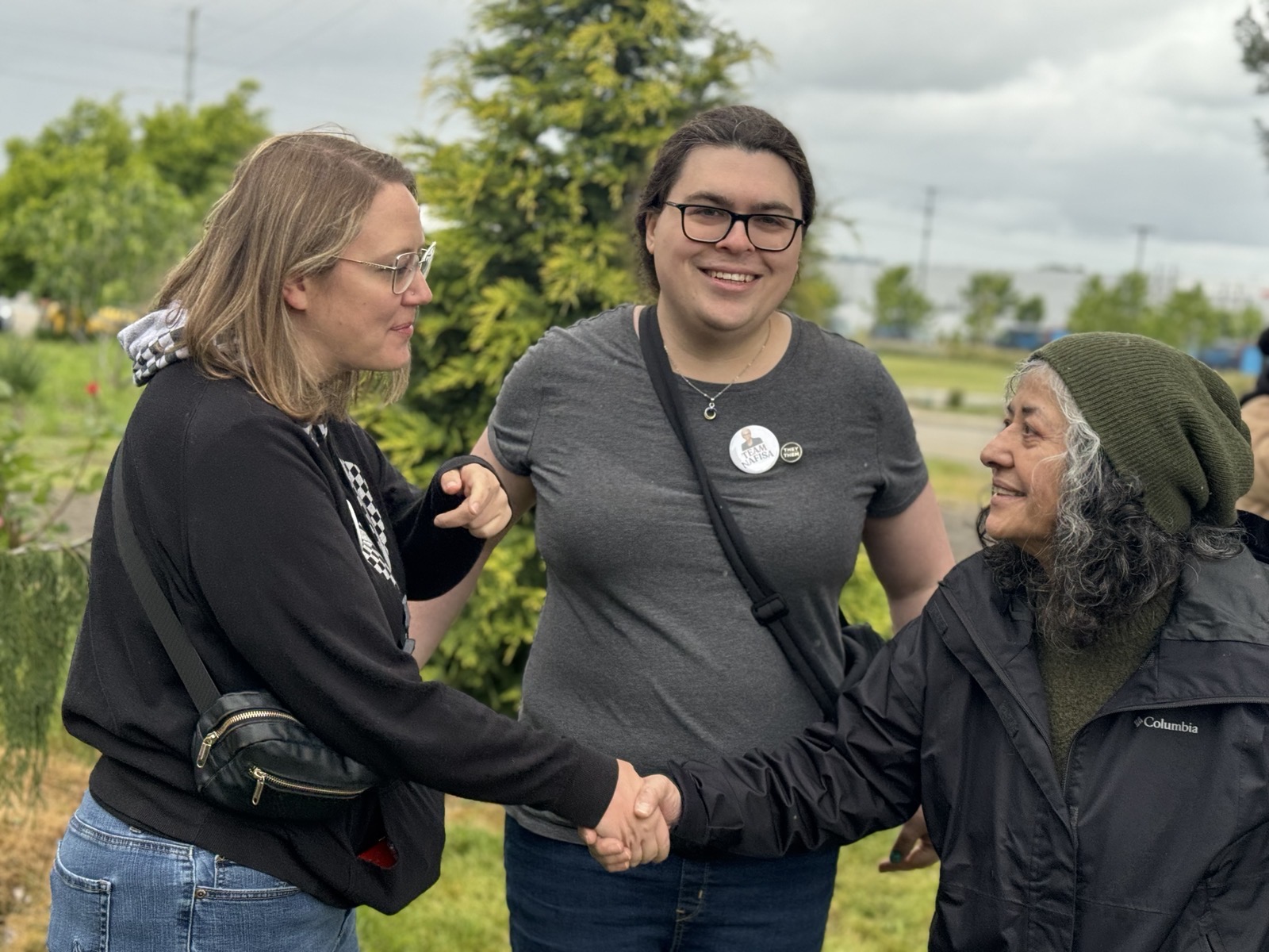 Diana shaking hands with a community member