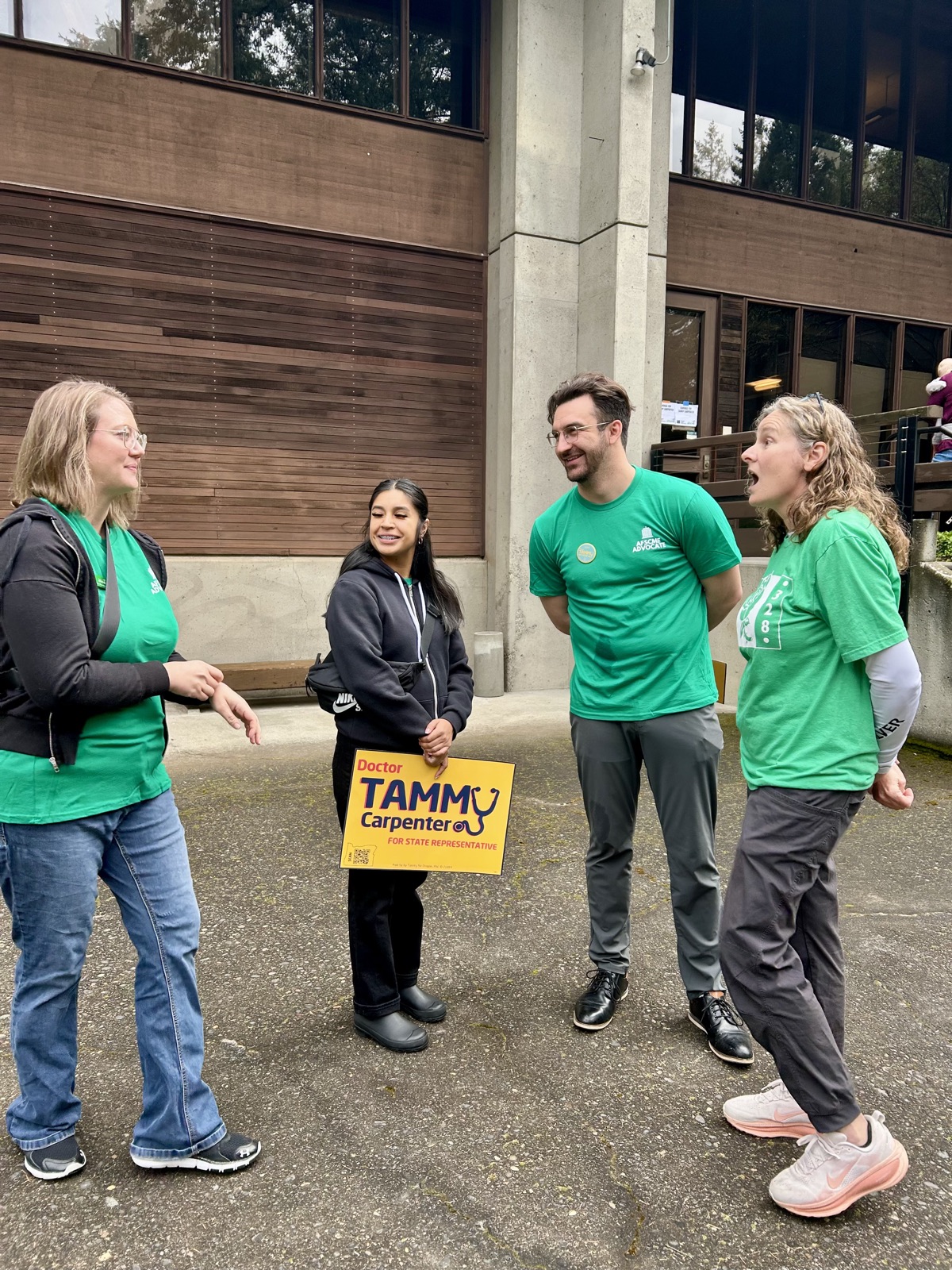 Union members talking outside a public building